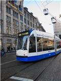 A tram whizzes by