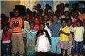 Kids singing inside Kibera church
