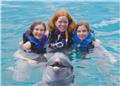 All 3 of us with a dolphin