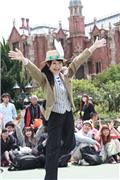 Castmember teaches hand motions for Easter Wonderland Parade