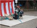 Monkey performing behind Senso-ji temple