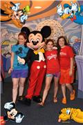 Posing with Mickey Mouse