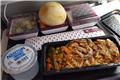Inflight dinner: chicken kapsa with fried onions
